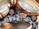 Novitskiy (left) and Pesquet in the Soyuz MS-03 ready for departure from the ISS. [NASA photo]